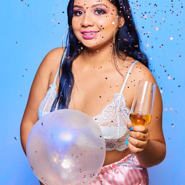 Kaveri Mehta, Lead Design Curator at Vast Field Bench, reviewing corporate floral arrangements